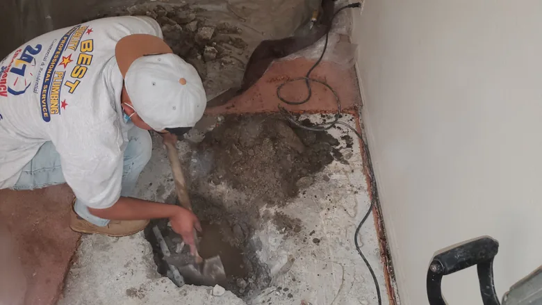 Technician opening a concrete floor