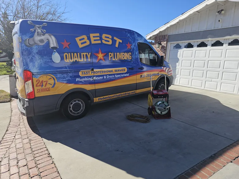 Branded van and portable equipment on driveway