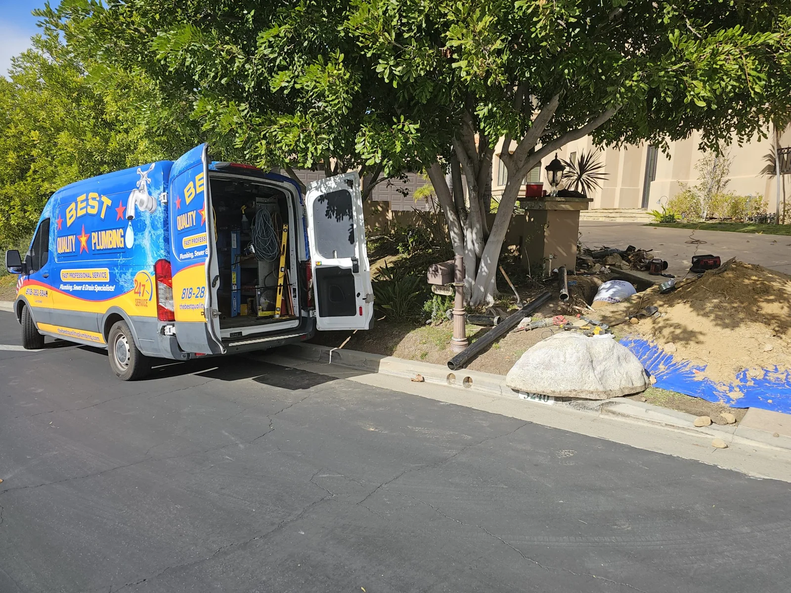 Best Quality Plumbing van beside a protected outdoor excavation